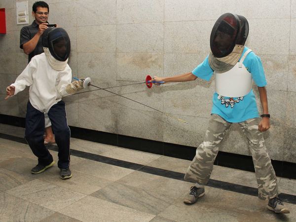 Like all sports that aren't cricket, fencing in India suffers from lack of infrastructure. Seen here are young boys practicing in a school foyer that is far from being conducive to the sport.