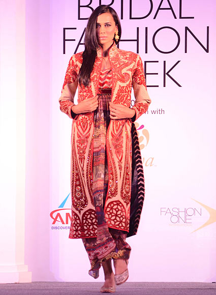 A model walks the ramp for JJ Valaya at the Aamby Valley India Bridal Fashion Week Preview in Delhi on July 10, 2013