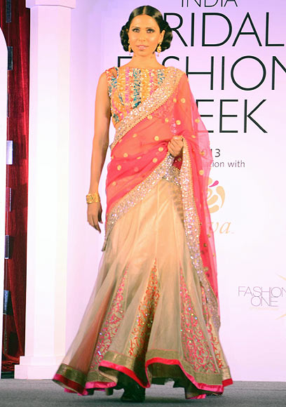Candice Pinto walks the ramp for Jyotsna Tiwari at the Aamby Valley India Bridal Fashion Week Preview in Delhi on July 10, 2013