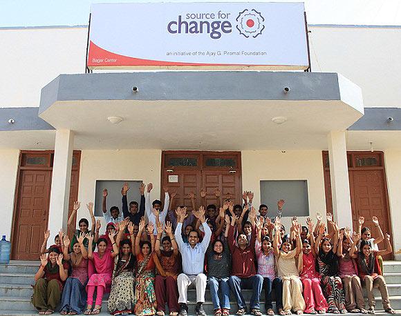 Shrot Katewa (centre) poses with his employees