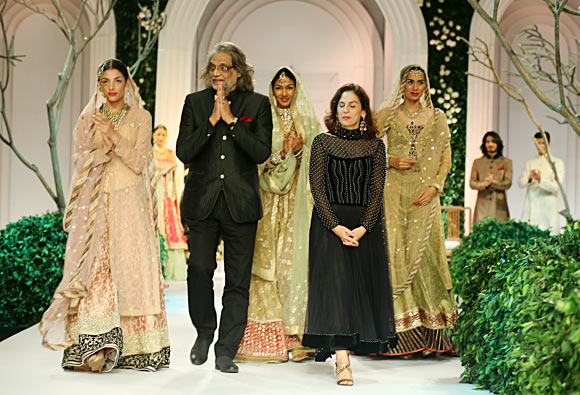 Muzaffar and Meera Ali flanked by their models