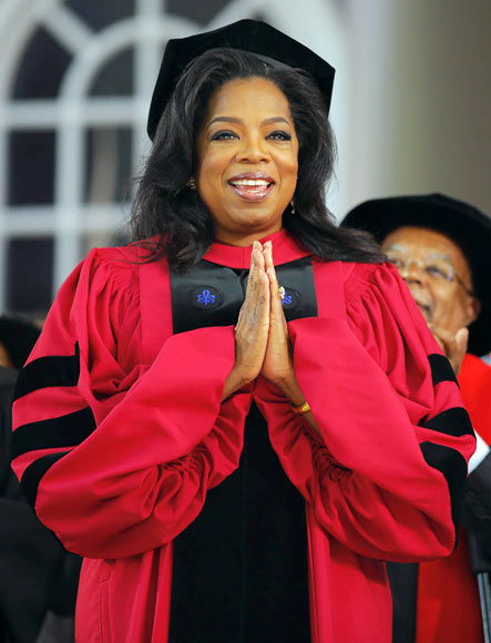 Media mogul Oprah Winfrey acknowledges the cheers from students and audience as she receives an honorary Doctor of Laws degree during Harvard University's 362nd Commencement Exercises in Cambridge, Massachusetts May 30, 2013