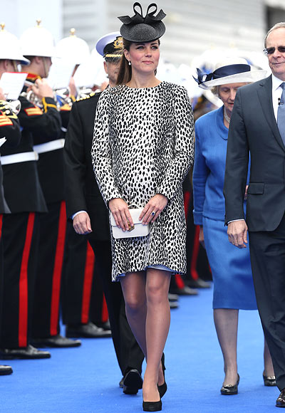 President and CEO of Princess Cruises Alan Buckelew (R) escorts Catherine, Duchess of Cambridge during the Princess Cruises ship naming ceremony at Ocean Terminal on June 13, 2013 in Southampton, England