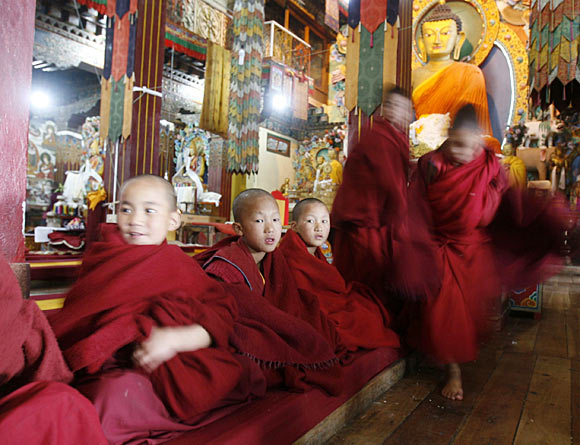 Child monks attend morning prayers inside the 17th century Tawang Tibetan Buddhist monastery in Arunachal Pradesh.