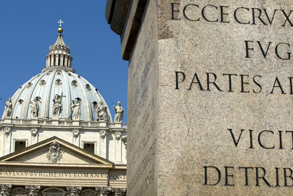 The obelisk (R) is seen near Saint Peter's Basilica, both of which play a part in novelist Dan Brown's book Angels & Demons, at the Vatican May 1, 2009.