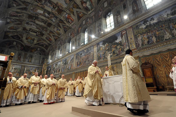 Newly elected Pope Francis I, Cardinal Jorge Mario Bergoglio of Argentina, leads a a mass with cardinals at the Sistine Chapel, in a picture released by Osservatore Romano at the Vatican March 14, 2013.