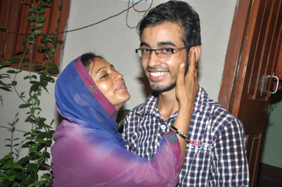Yasmeen Shafi with her son Hanjala celebrating his success