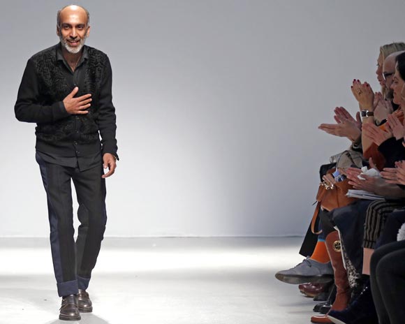 Manish Arora acknowledges applauses after the presentation of his Ready-to-wear collection at the Paris Fashion Week, February 28, 2013.