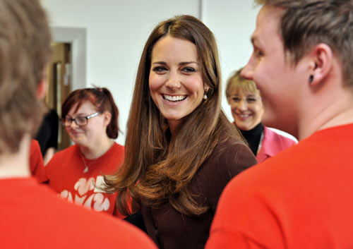 Britain's Catherine, Duchess of Cambridge speaks with unemployed young people who are taking part in The Prince's Trust Scheme, during her visit to Peaks Lane fire station in Grimsby, northern England March 5, 2013.