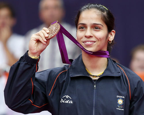 India's Saina Nehwal holds up her bronze medal at the women's singles badminton victory ceremony at the London 2012 Olympic Games at the Wembley Arena August 4, 2012.