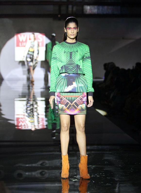 A model shows a Manish Arora outfit.