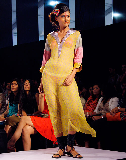 A model wears a pale yellow Anupama Dayal creation