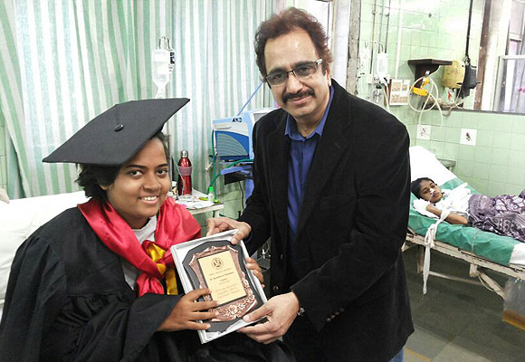 Samidha Khandare receives her MBBS degree from Dr Suleiman Merchant, former dean of Sion Hospital, in February 2013