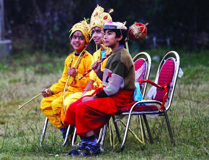 : Kashmiri children dressed as Lord Rama, Lakshman and Hanuman in Srinagar