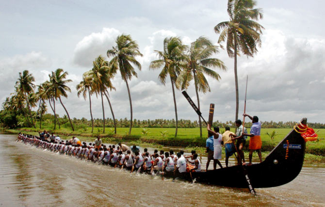 Indian oarsmen row their boat during a practice session for upcoming Nehru boat race in Alleppy district in Kerala