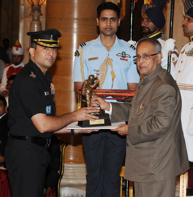  The President, Pranab Mukherjee presenting the Tenzing Norgay National Adventure Award-2012 to Major Ranveer Singh Jamwal for Mountaineering, at the National Sports & Adventure awards ceremony, at Rashtrapati Bhawan, in New Delhi on August 31, 2013.