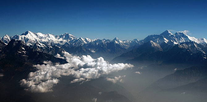 Mount Everest (2nd R), the world highest peak, and other peaks of the Himalayan range are seen from air during a mountain flight from Kathmandu