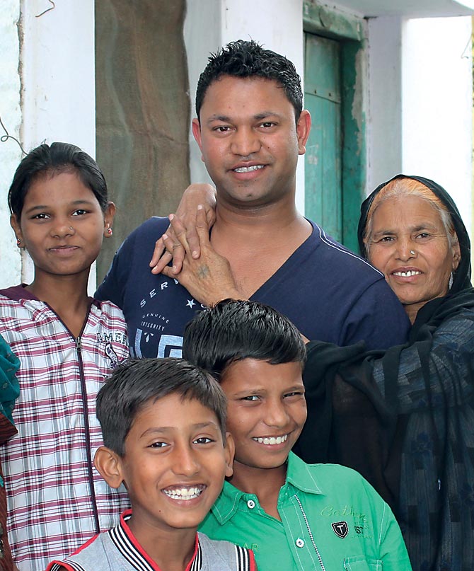 Saroo Brierley reunited with his mother (to his left). Also seen here is his brother Kallu's daughter Norin, his sister Shekila's son Ayan and one of Kallu's sons Shail.