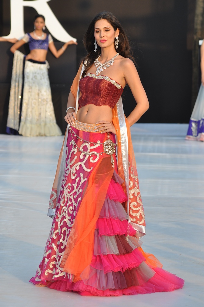 Bruna Abdullah walks the runway at India Resort Fashion Week in Goa in a floor-length anarkali for Shouger Merchant Doshi.