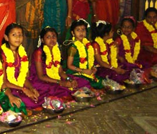 During Kanya Pooja, nine young girls are served food and goodies