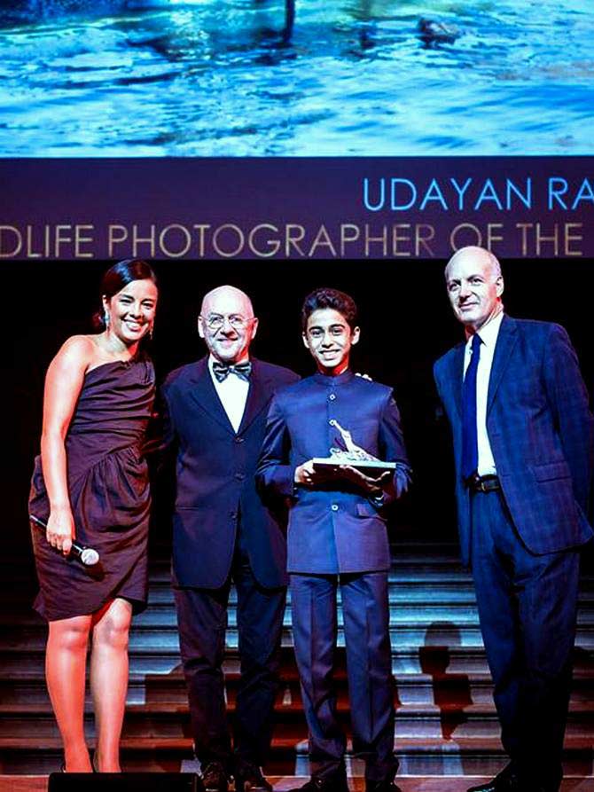 14-year-old Udayan Rao Pawar (third from left) receives the prestigious award from the well-known environmentalist and photographer Jim Brandenburg (second from left) at Britain's Natural History Museum in London.
