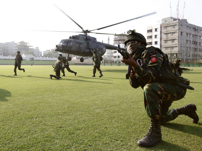 A file picture of army personnel taking part in a mock emergency drill after a controlled blast at a stadium in Dhaka.