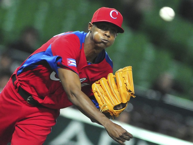 A file picture of Cuba's Raciel Iglesias as he pitches a ball during the last preparation game for the World Baseball Classic (WBC) in Fukuoka, Japan