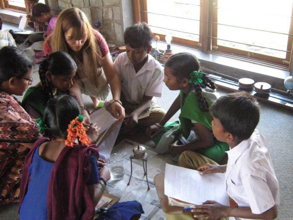 Deshpande Foundation's Sandbox Fellow interacts with children from a rural Indian school