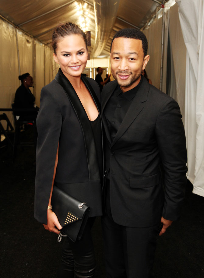 Model Chrissy Teigen and John Legend pose outside the Samsung Galaxy Lounge at Mercedes-Benz Fashion Week Spring 2014 Collections at Lincoln Center on September 10, 2013 in New York City.