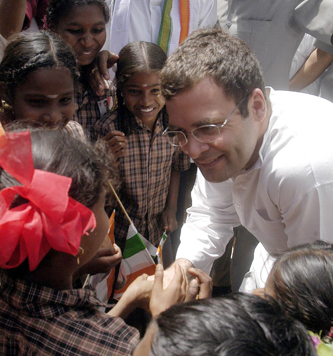 Rahul Gandhi interacts with young school girls in this undated picture.
