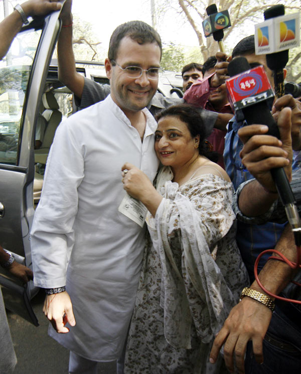 A well-wisher embraces Rahul Gandhi as he leaves after casting his vote at a polling station in New Delhi in this May 2009 picture.