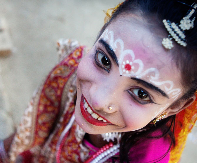 This image was commended at the 2014 Sony World Photography Awards (Smile section). The spontaneous emotion, the sweet smile of the girl participating in a local festival attracted me to shoot her photograph from a different angle.