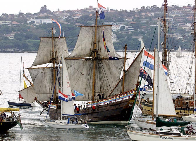 Spectator craft escort the Duyfken as she leaves Sydney harbour on her 18,000-nautical mile voyage to The Netherlands