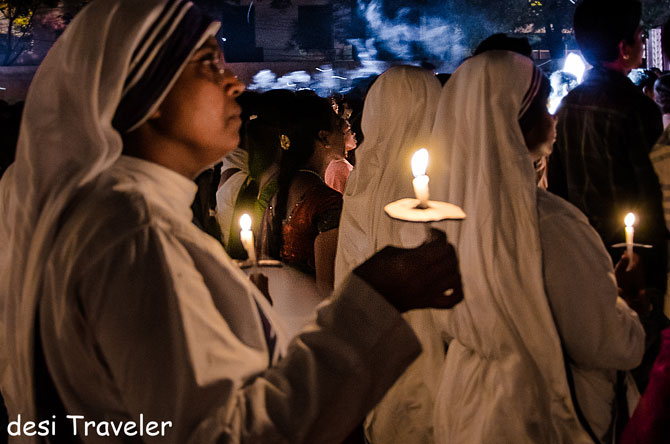Nuns pray at the midnight mass.