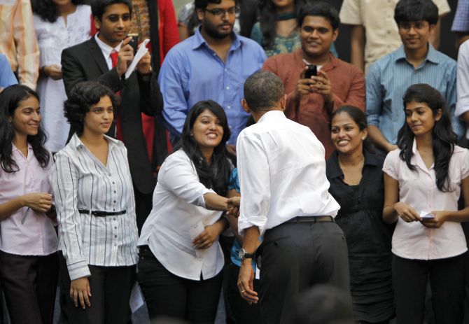 U.S. President Barack Obama greets students at a town hall meeting at St. Xavier's college in Mumbai.