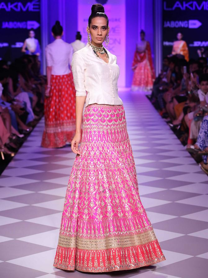 Sony Kaur models a pink lehenga by Anita Dongre.