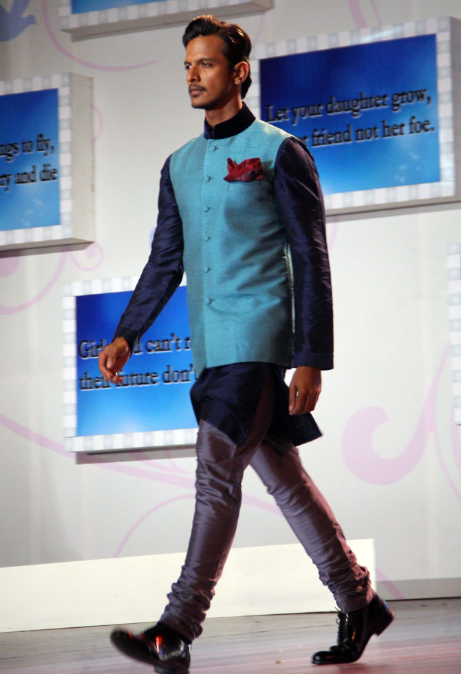 A model walks in a Manish Malhotra outfit