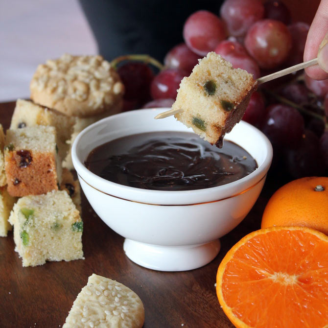 Chocolate fondue with fresh fruits, dense walnut cake and peanut cookies