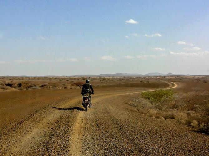 Riding the deserts along Lake Turkana, Kenya.