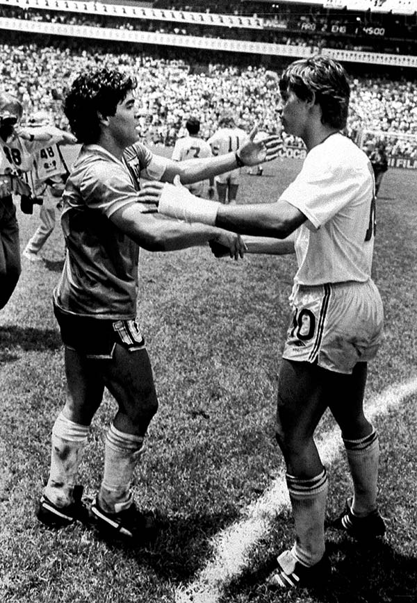 Argentine World Cup star Diego Maradona (L) is greeted by England's Gary Lineker (R) on the pitch following their World Cup quarter final in Mexico, June 22, 1986. Maradona scored both goals in Argentina's 2-1 victory.
