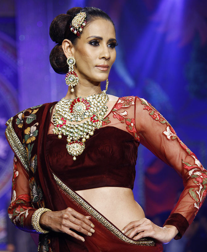 Kavita Kharayat walks the runway at the India International Jewellery Week.