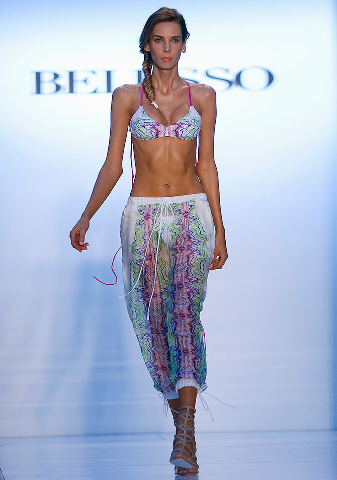 A model walks the runway at the Mercedes Benz Swim Fashion Week.