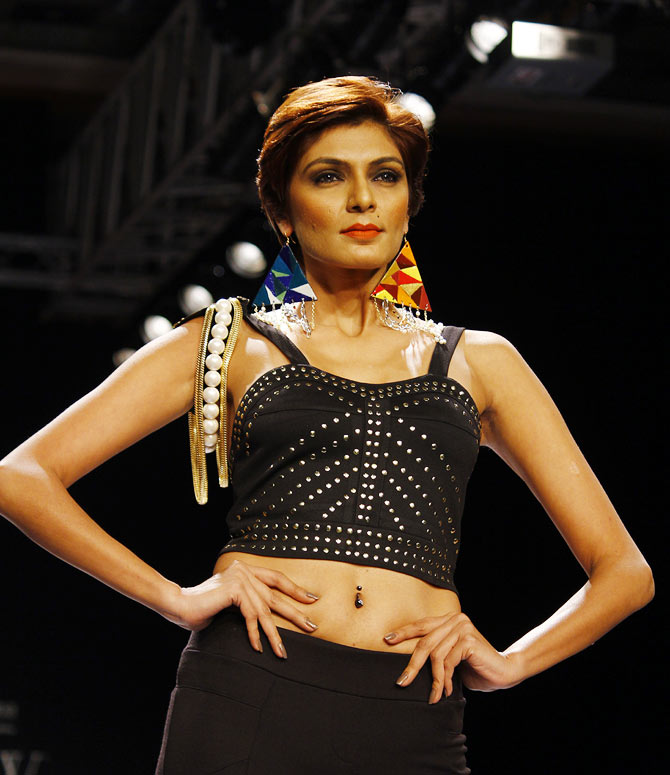 A model walks the runway for Indian Institute of Gems & Jewellery.