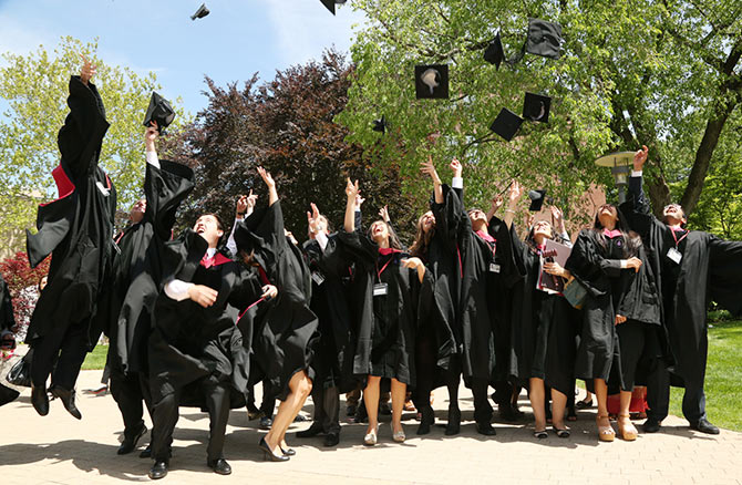 Harvard Law graduate class of 2014 throw their hats in the air on Graduation Day.
