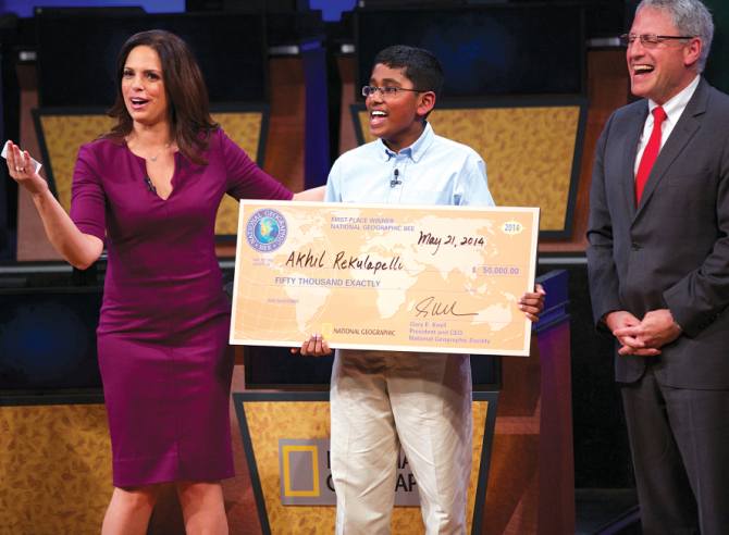 National Geographic Bee winner Akhil Rekulapelli with journalist and Bee moderator Soledad O'Brien, left, and National Geographic President and Chief Executive Officer Gary E Knell.