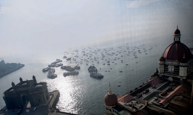 A view of the Arabian Sea with the Gateway of India on the left and a part of the Taj Mahal Hotel to the right.