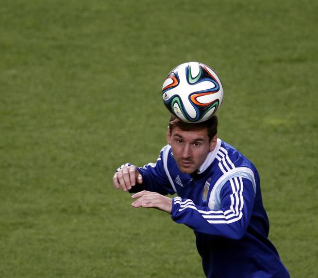 Argentina's Lionel Messi heads the ball during a training session in preparation for 2014 World Cup at Independecia stadium in Belo Horizonte, June 11, 2014.