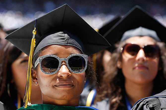 Students listen to President Obama during the commencement ceremony for the University of California, Irvine at Angels Stadium in Anaheim, California.