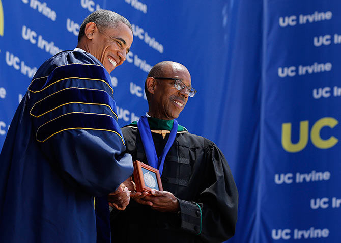 US president Barack Obama receives a medallion from University of California, Irvine Chancellor Michael Drake