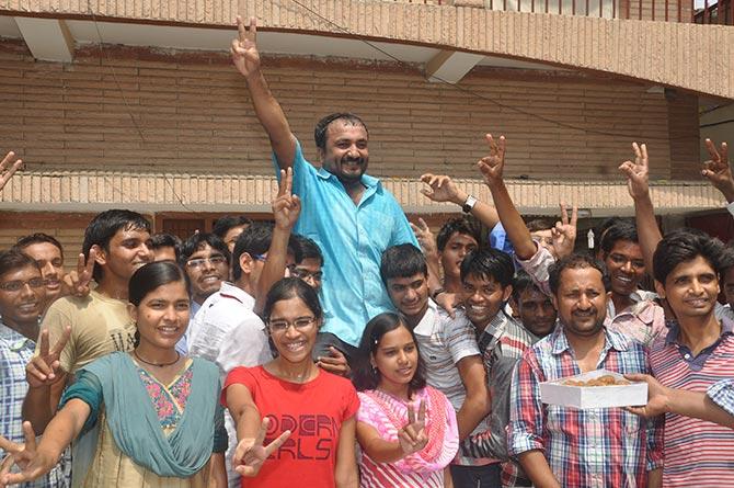 A jubilant Anand Kumar (in blue shirt) celebrates with his students in Patna.